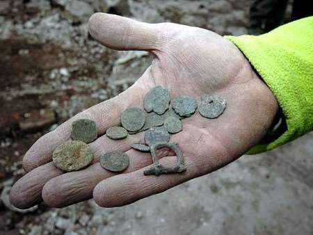 A fistful of denarii... coins discovered close to the Roman wall unearthed by archaeologists at Rochester Riverside