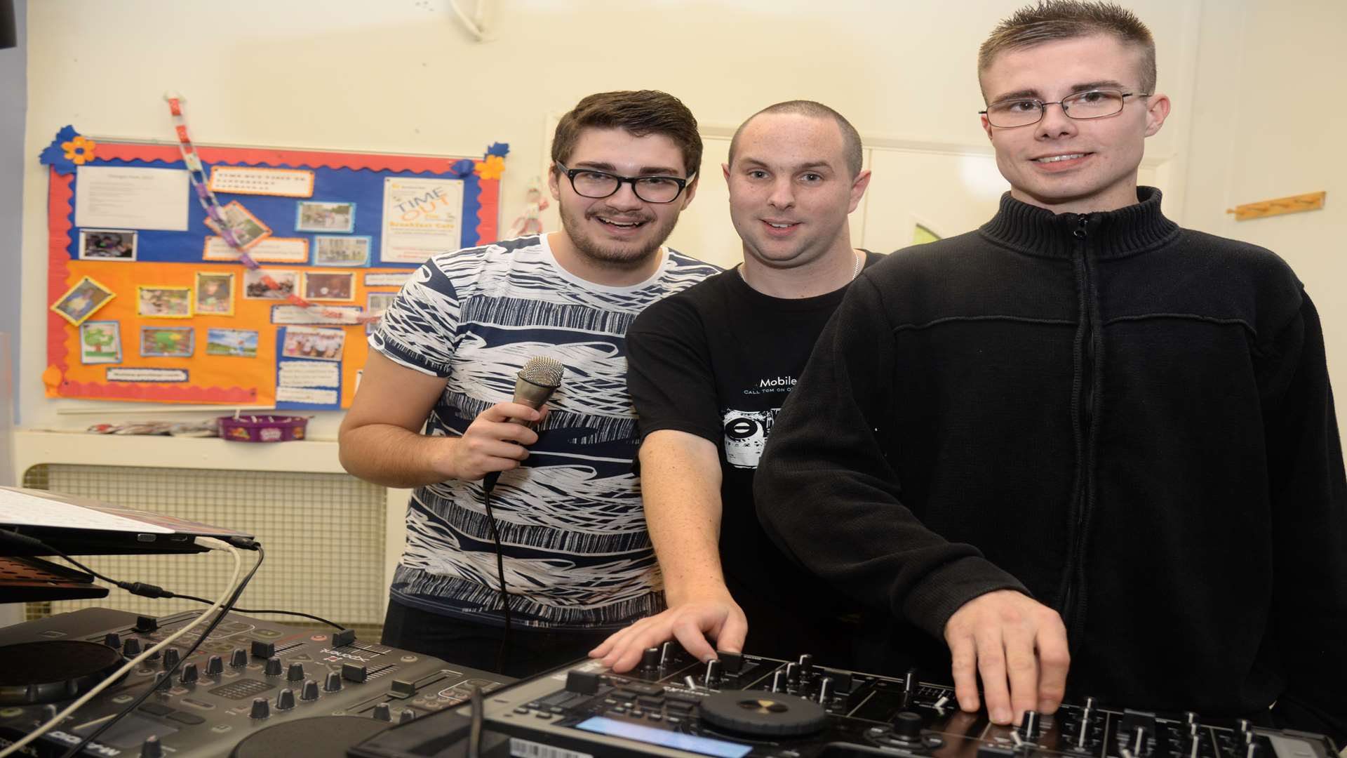 KMFM's DJ Ben Pearce with fellow Disco DJ's Tom Smith and Ben Warner at the Spring Lane Neighbourhood Centre children's Christmas party on Friday. Picture: Chris Davey FM3573262