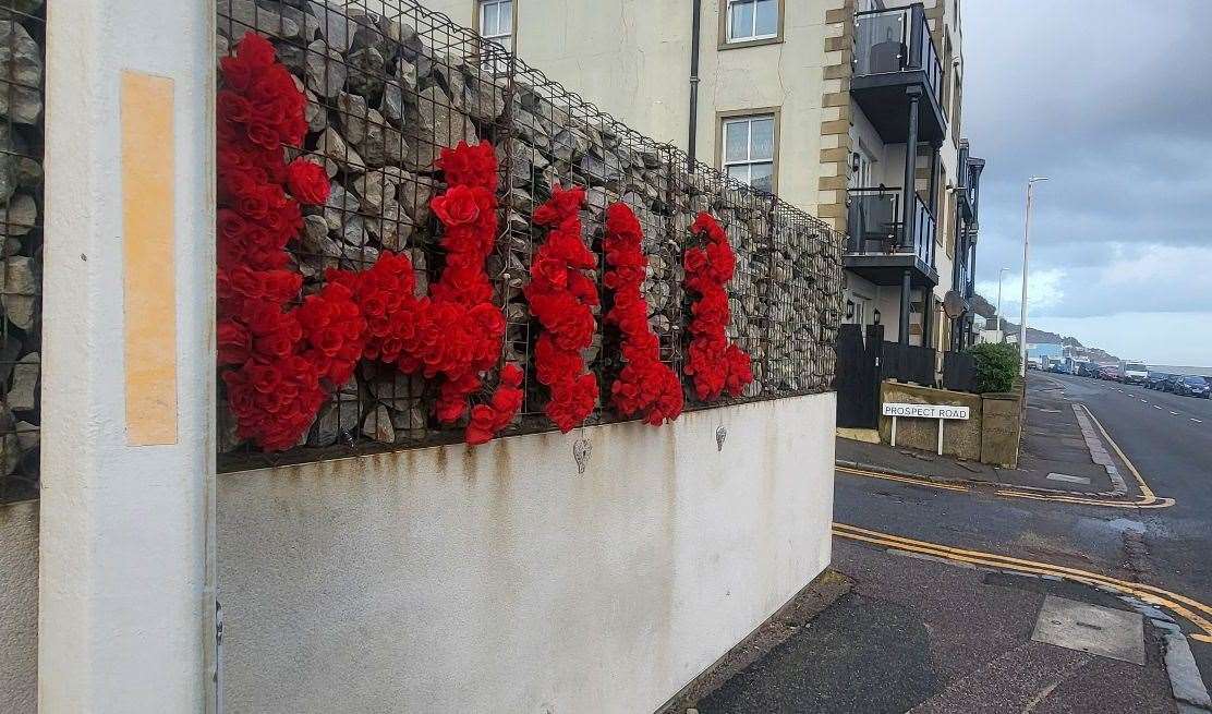 Floral tributes have been left along Sandgate Esplanade at the junction with Prospect Road