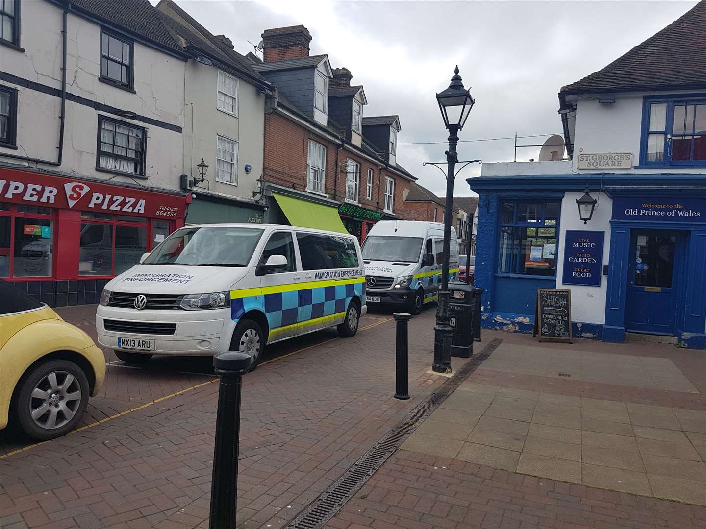 Two Immigration Enforcement vehicles are currently parked in the town centre. (9074870)