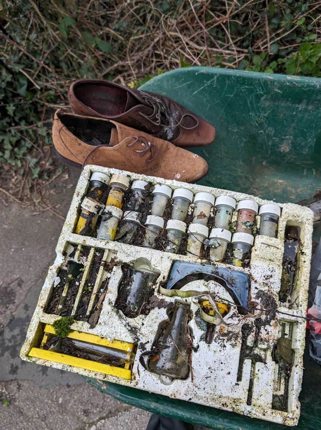 A science kit was pulled from the river along with a pair of shoes. Photo: Jo Hill