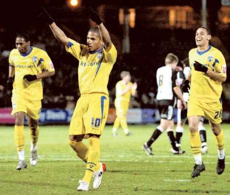 Simeon Jackson salutes the Gills fans after scoring the final goal in a 3-1 win at Port Vale