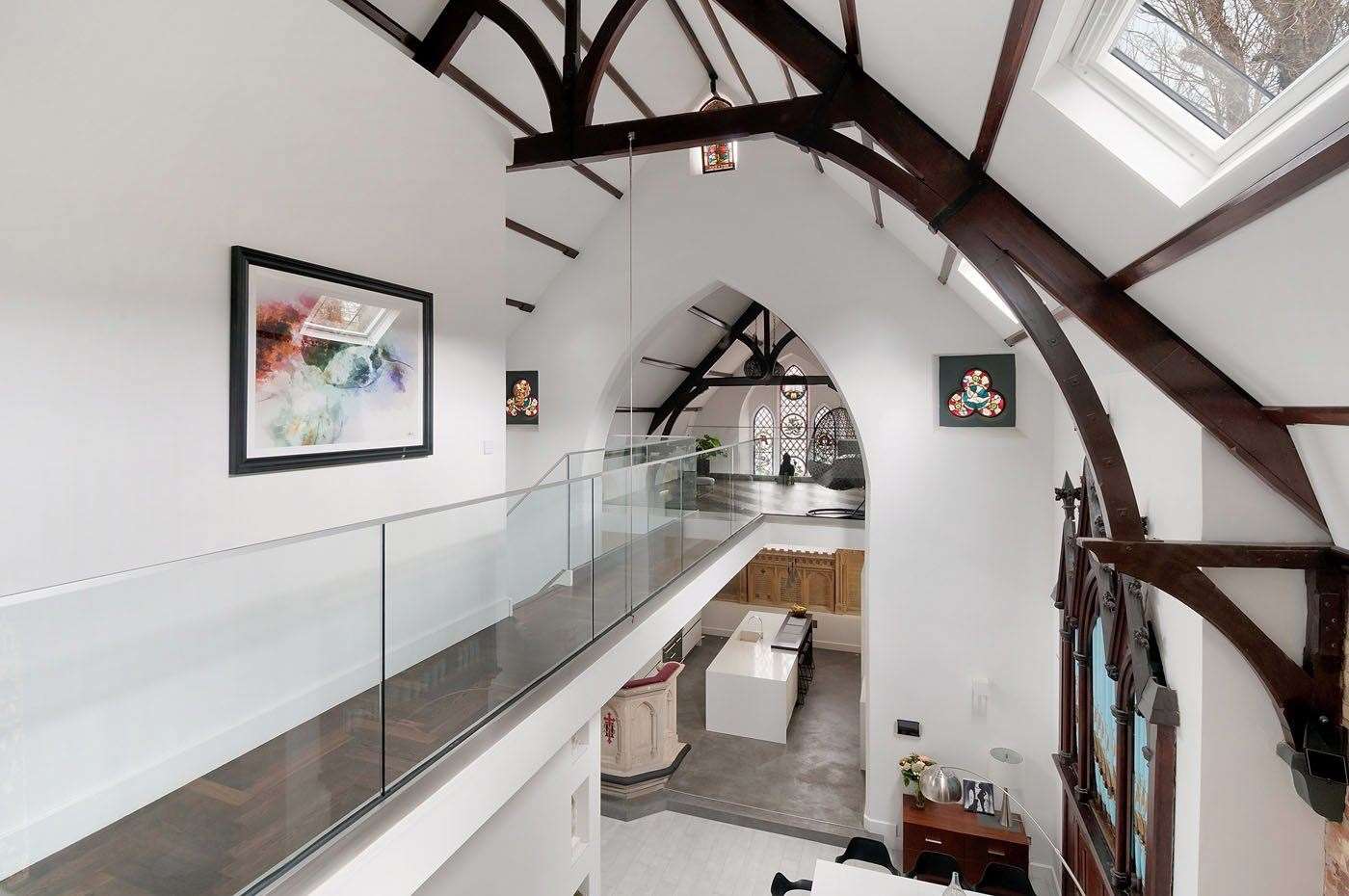 A glass mezzanine provides a brilliant view of the downstairs area