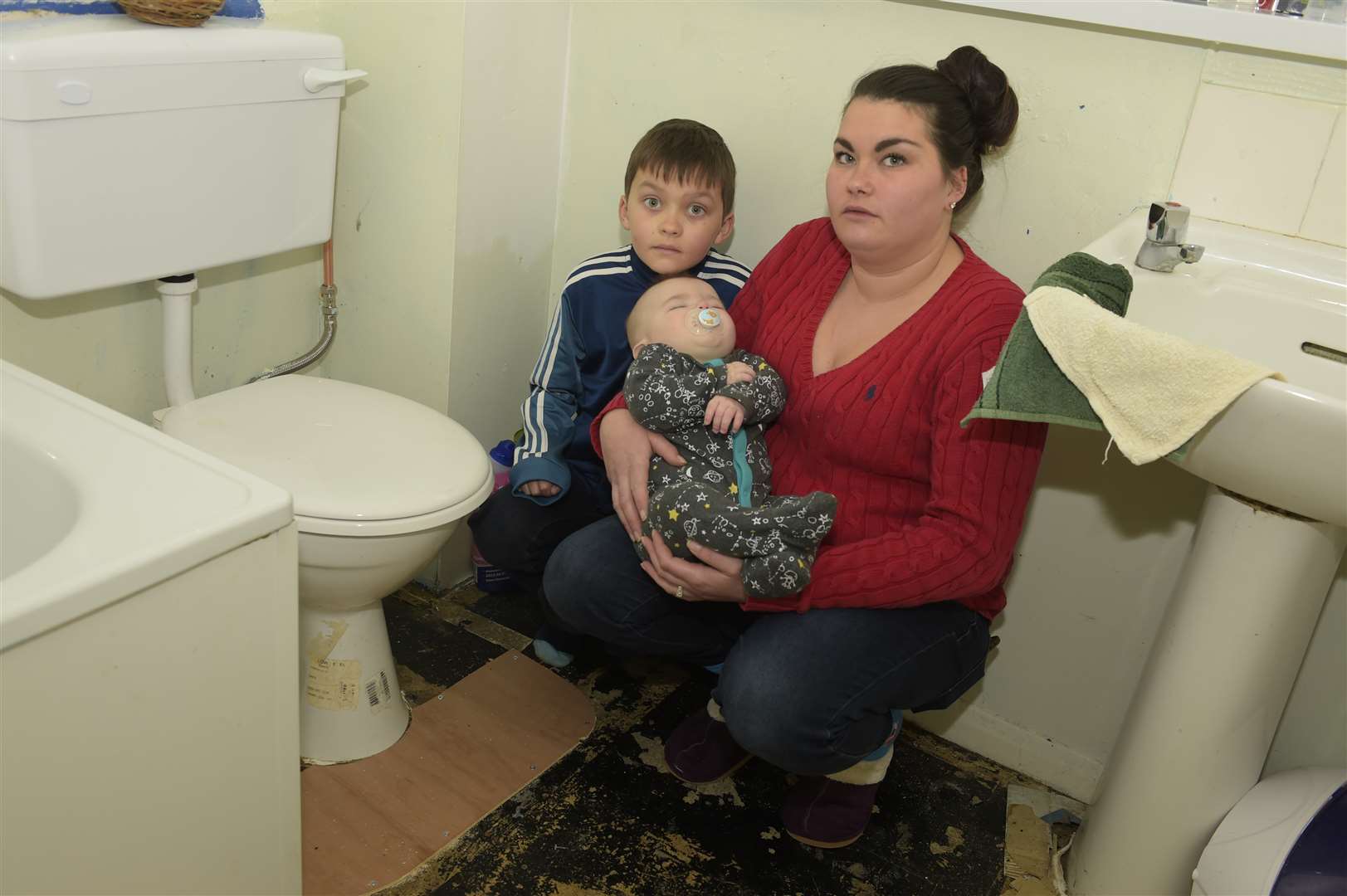 Links Road, Deal. Louise New is concerned about a leak in her bathroom. eight year old Jake New, four month old Bleu New and Louise New.Picture: Tony Flashman (1209073)