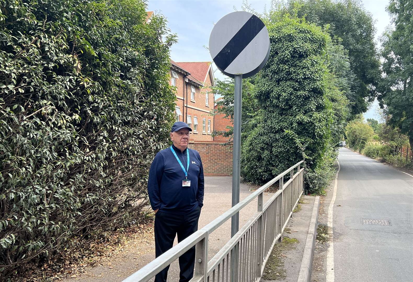 Cllr James Hall at the national speed limit sign along Tonge Road, Murston