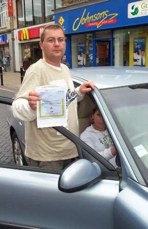 Piotr Ciesielski with the parking ticket.