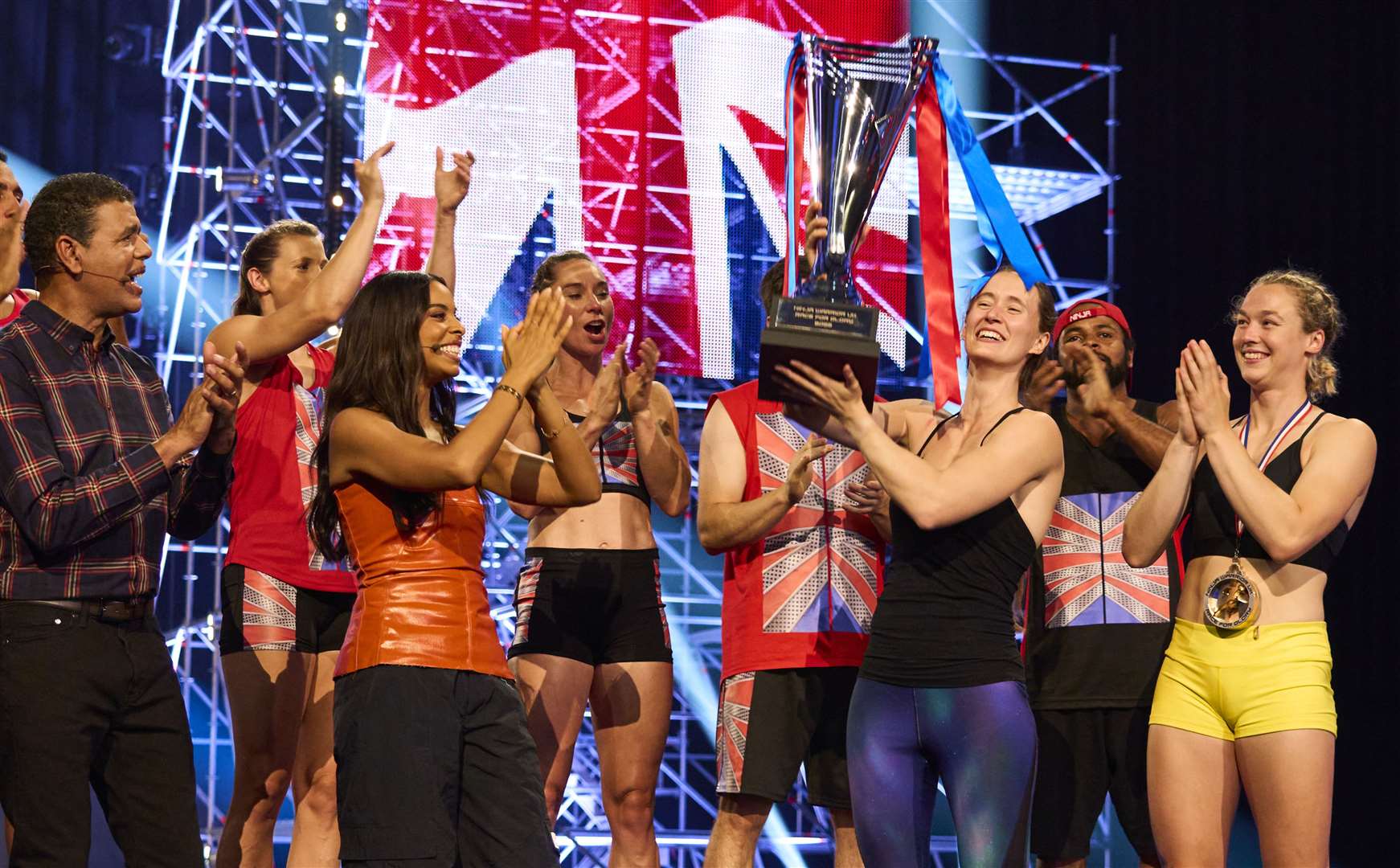 Beth lifting her trophy on Ninja Warrior UK. Picture: ITV
