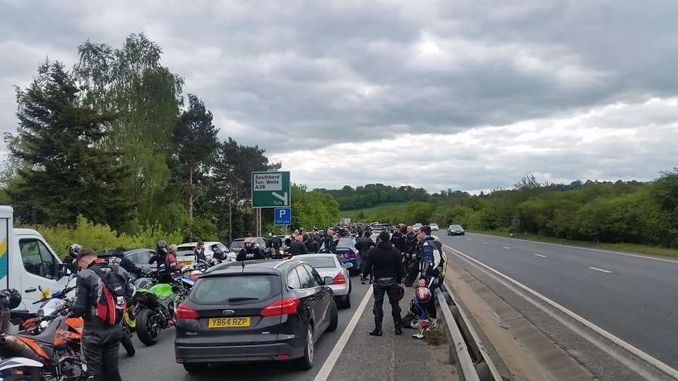 Bikers stretch their legs while waiting for the A21Tonbridge Bypass to reopen. Picture: Keith Roberts (9740215)