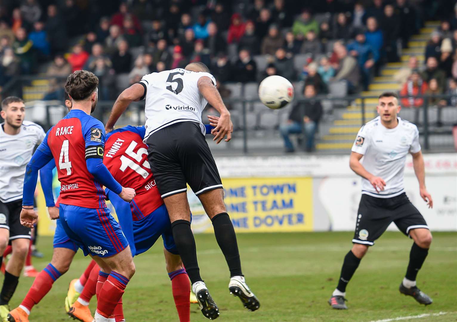 Captain Kevin Lokko heads Dover 1-0 in front. Picture: Alan Langley