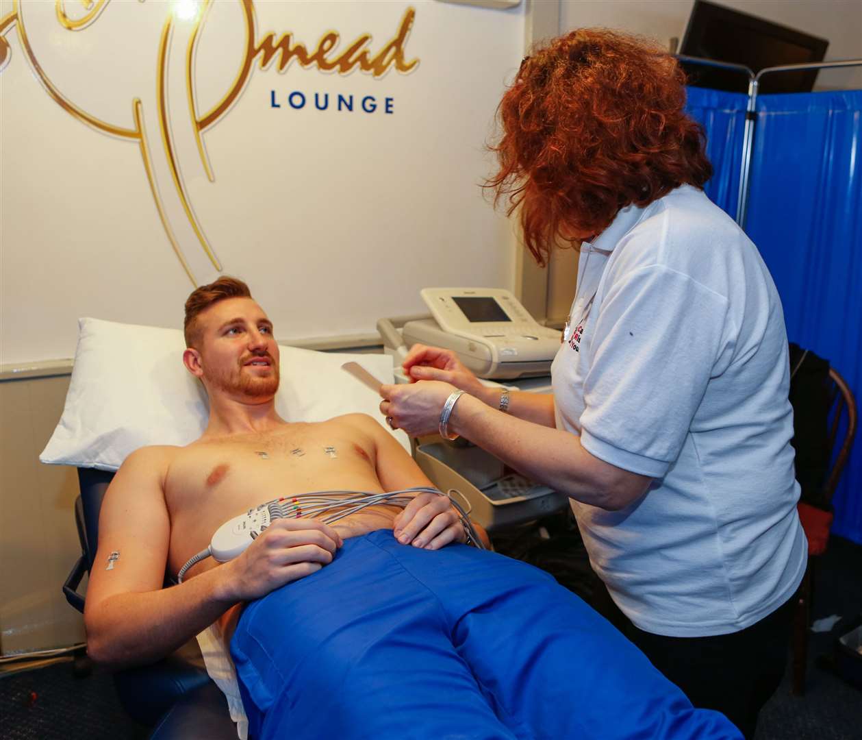 Tom Phipp, now with Herne Bay FC, gets tested by Janice Wand as part of the first heart screening day at Tonbridge Angels' Longmead Stadium. Picture: Matthew Walker