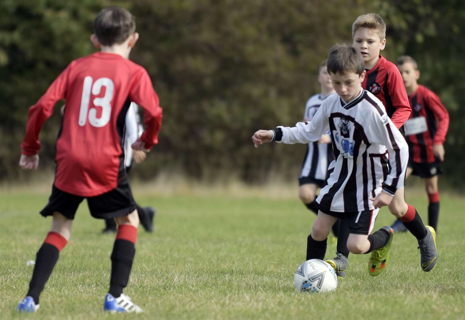 Milton & Fulston United under-9s on the ball against Rainham Kenilworth under-9s. Picture: Barry Goodwin (42331493)