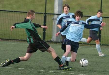Minster College (blue) in Division 3 action against Swale Athletic