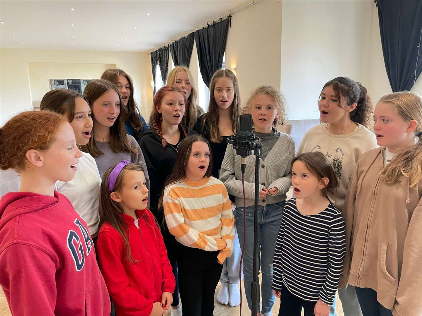 Children from the YT93 theatre group practise Carol of the Bells