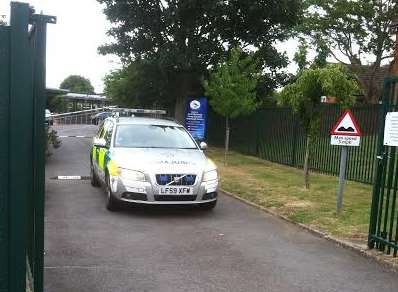 An ambulance car leaves the school