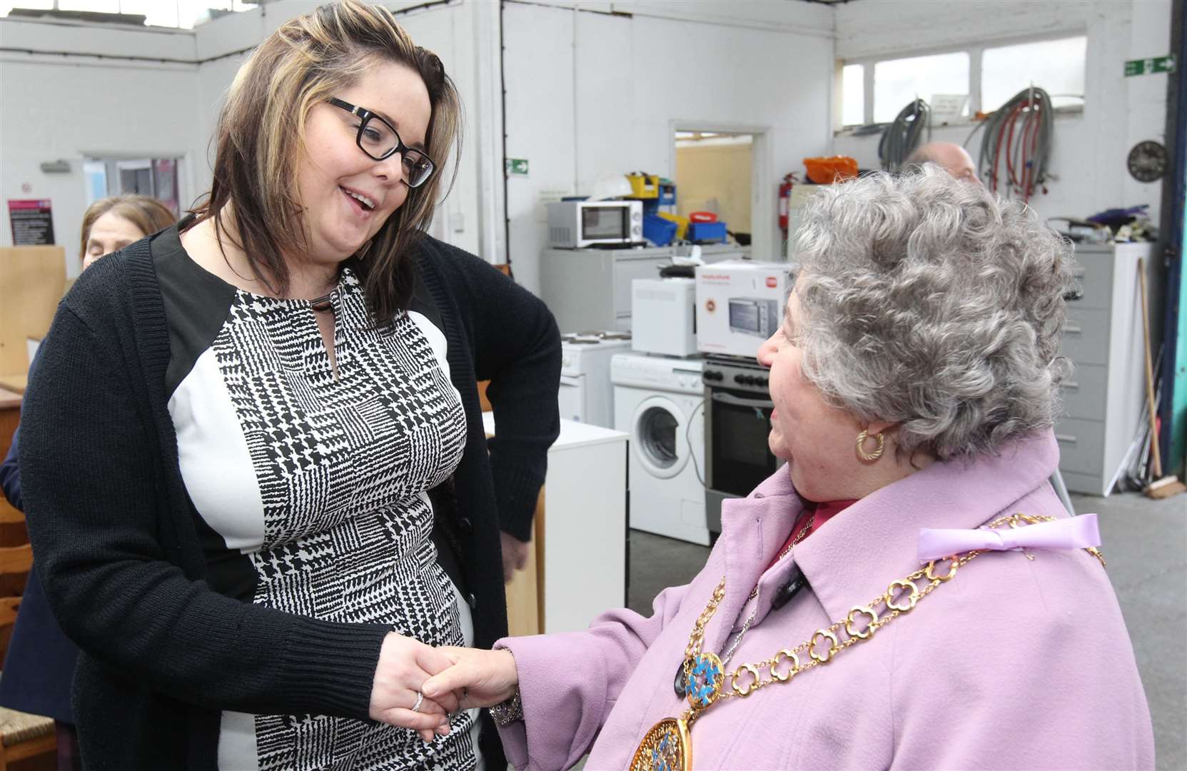 Evelyn Saunders, manager of The Neighbourhood Furniture Store, meets the then Mayor of Swale, Cllr Anita Walker, in 2016 Picture: John Westhrop