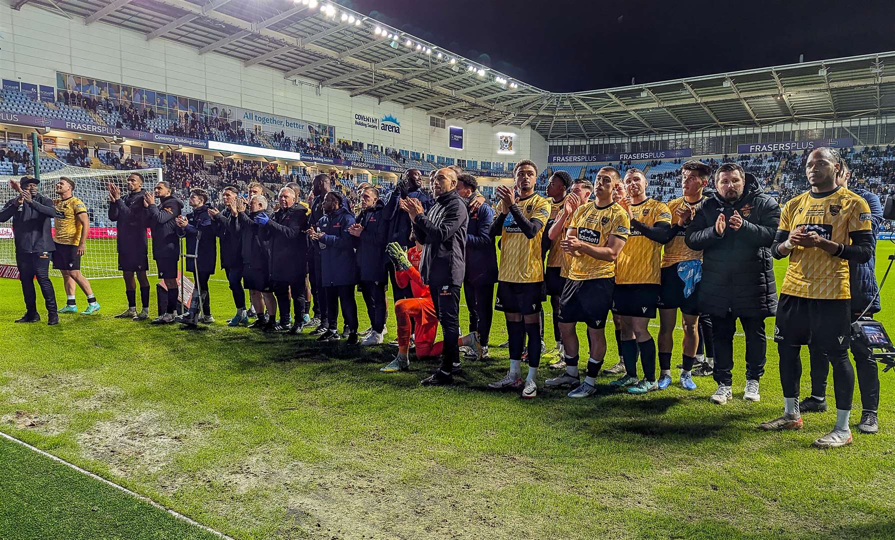 Maidstone players and staff thank the 4,800 away fans at full-time. Picture: Helen Cooper