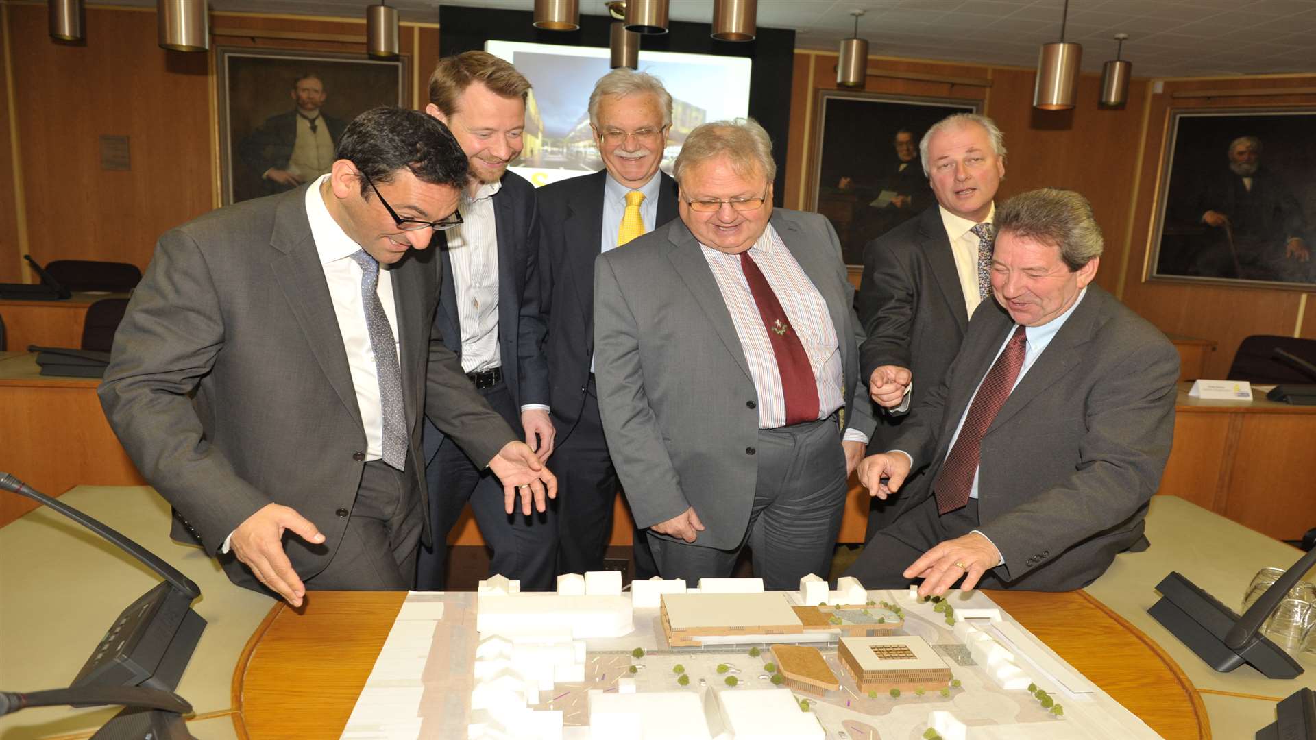 Businessmen and councillors with a 3D model of how the town could look after the regeneration