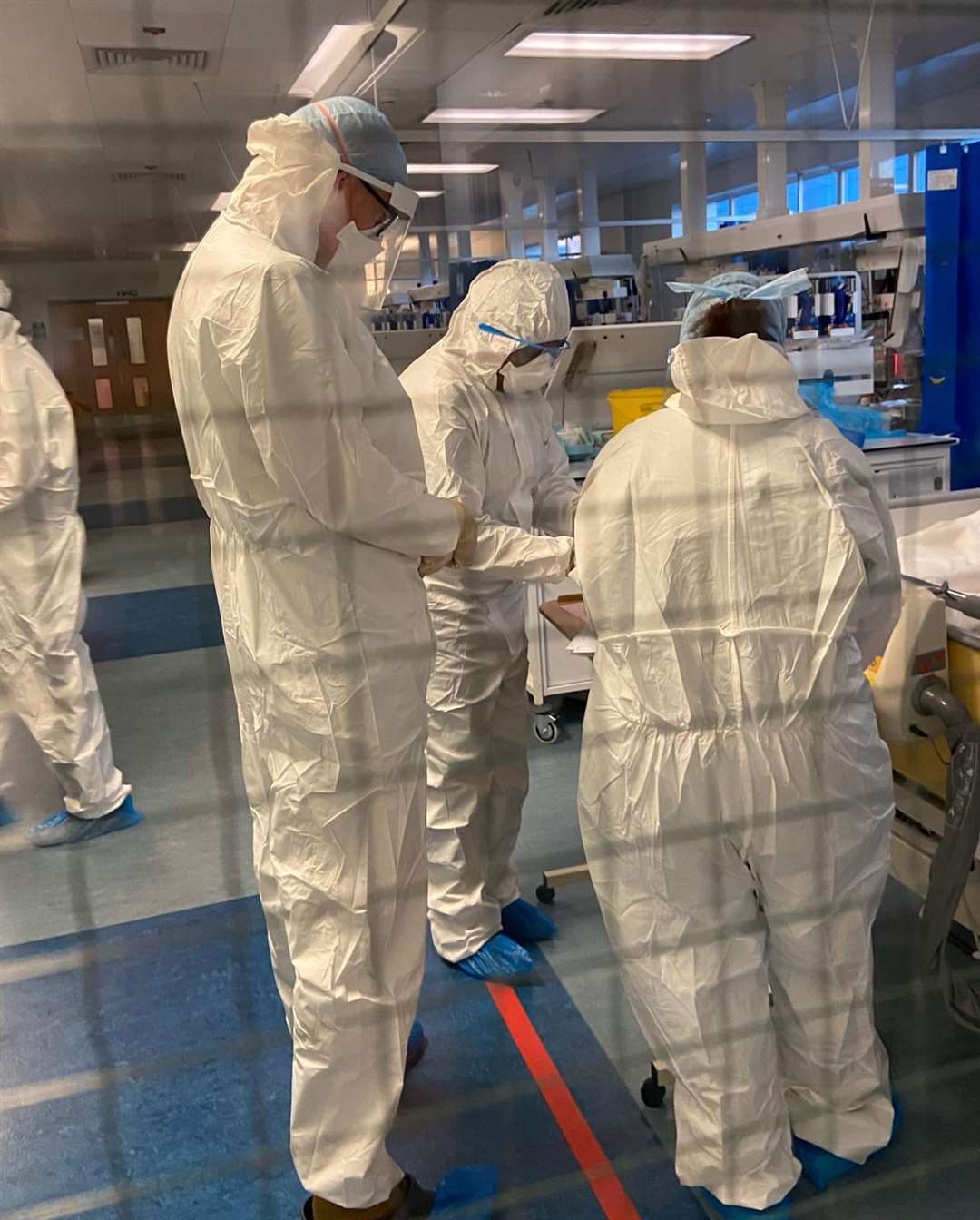 NHS staff treating Covid-19 positive patients while wearing PPE