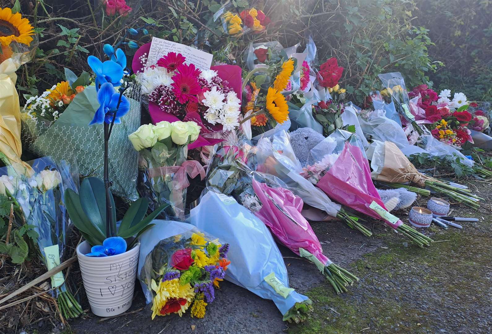 Flowers and candles have been left near the scene of Bella Goldsmith's death