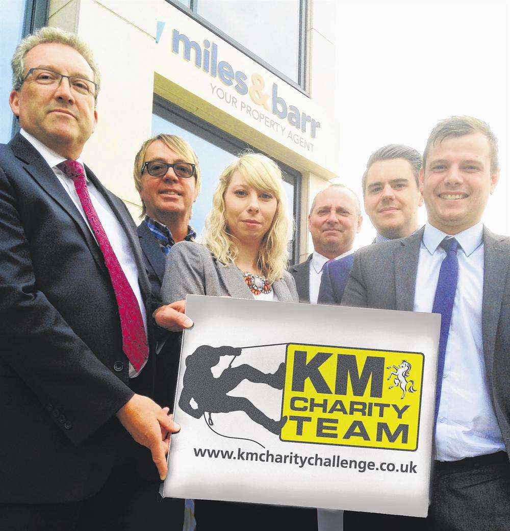 Miles and Barr Director Rob Sabin (second right) and his team outside their brand new offices. The company is supporting the KM Abseil Challenge in Canterbury on Saturday, November 1 at the Premier Inn