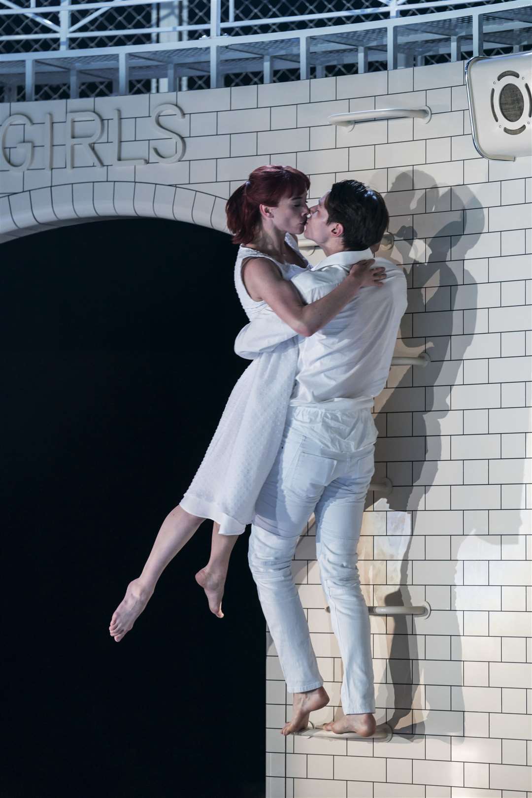 Juliet (Cordelia Braithwaite) and Romeo (Paris Fitzpatrick) share a never ending kiss as he lifts her through the air in Matthew Bourne's Romeo and Juliet at the Marlowe Theatre. Credit: Johan Persson