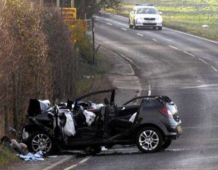 Emergency services cut a woman free from her car following the accident on Calcott Hill on Friday.