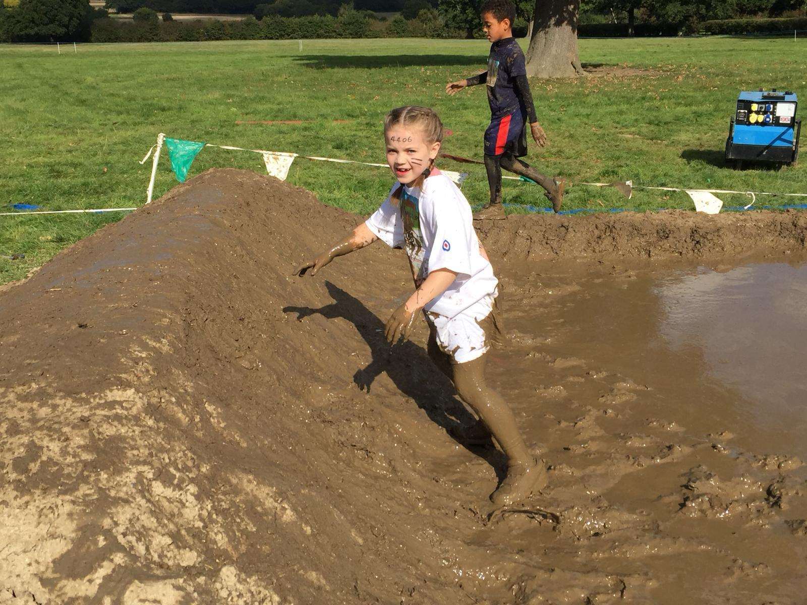 Brooke running through the muddy challenge. Picture: RAF Benevelant Fund
