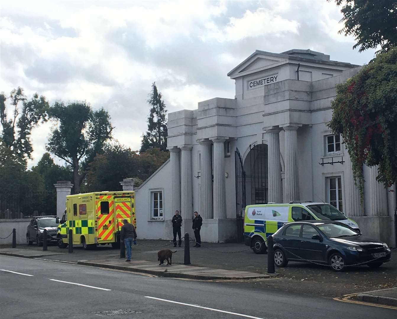 Police and medics have been pictured outside Gravesend cemetery