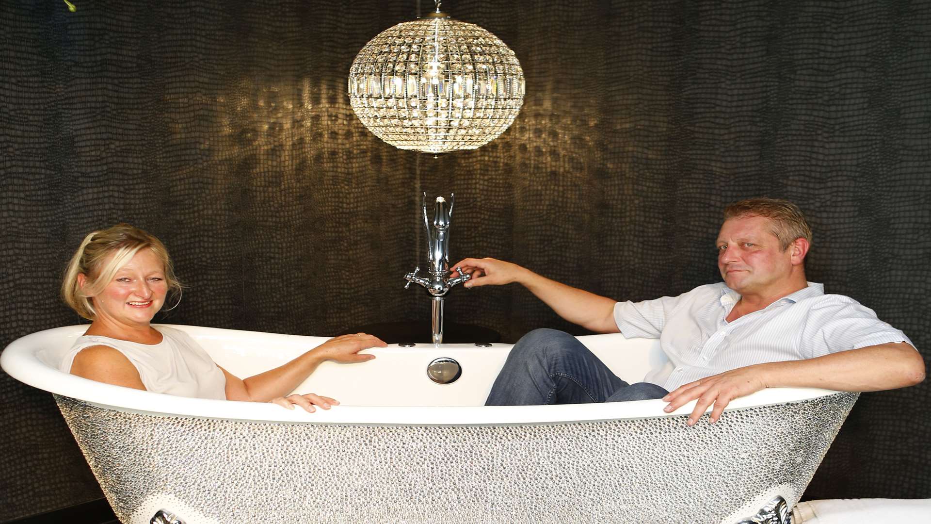 Leigh-Anne McCague and Joe Mallett in the bath in the Ace of Spades suite