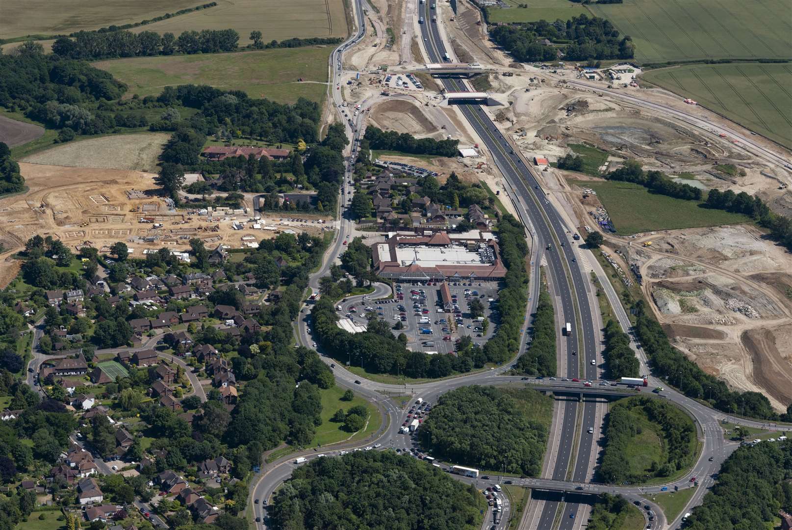 Junction 10a is being constructed 700 metres south east of Junction 10. Tesco Extra can be seen in this photo, as well as the Hinxhill Park construction site to the left of the shot where 200 homes are being built off the A20. Picture: Ady Kerry / Ashford Borough Council