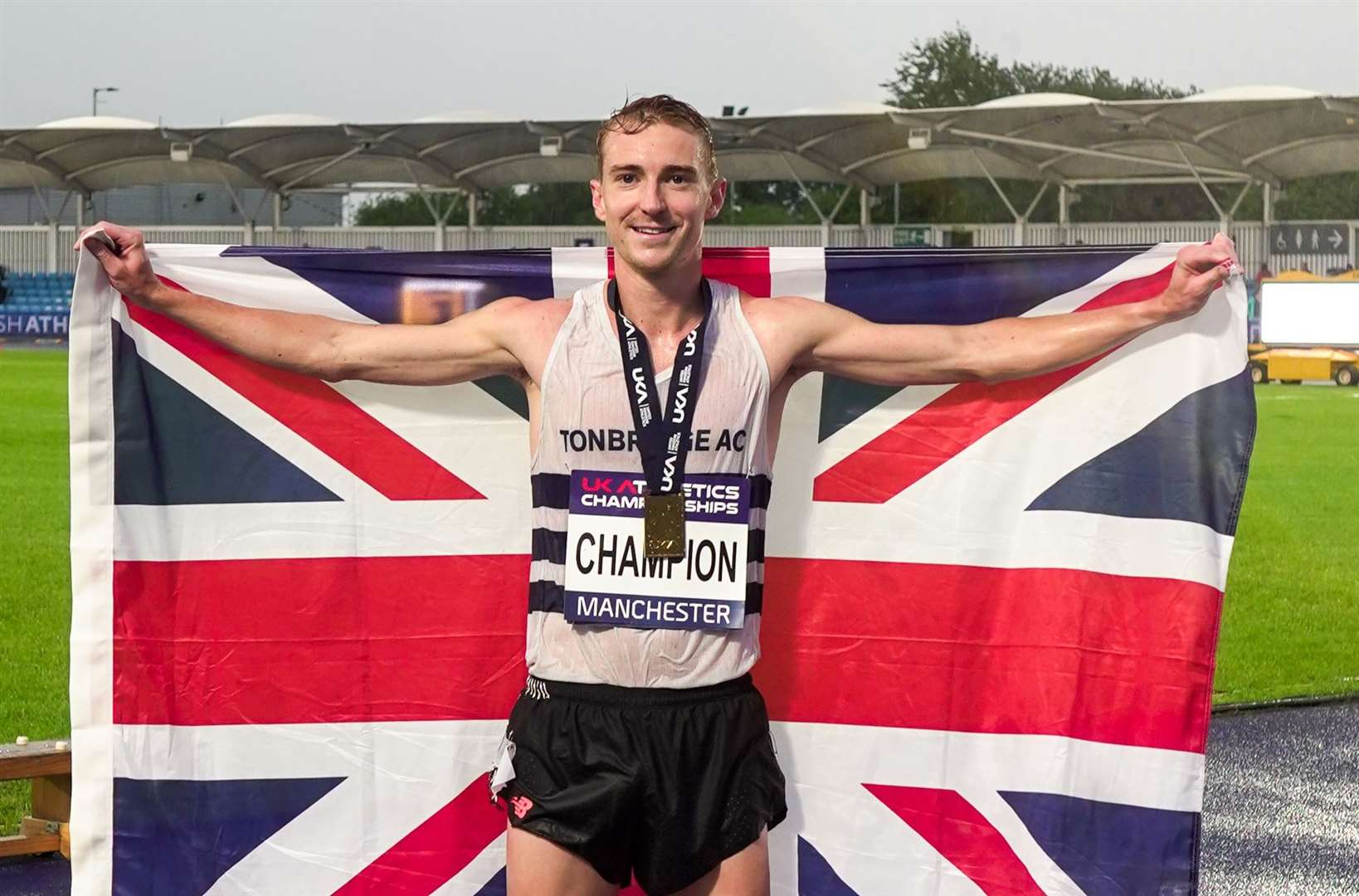James West celebrating after his 5,000m triumph in Manchester