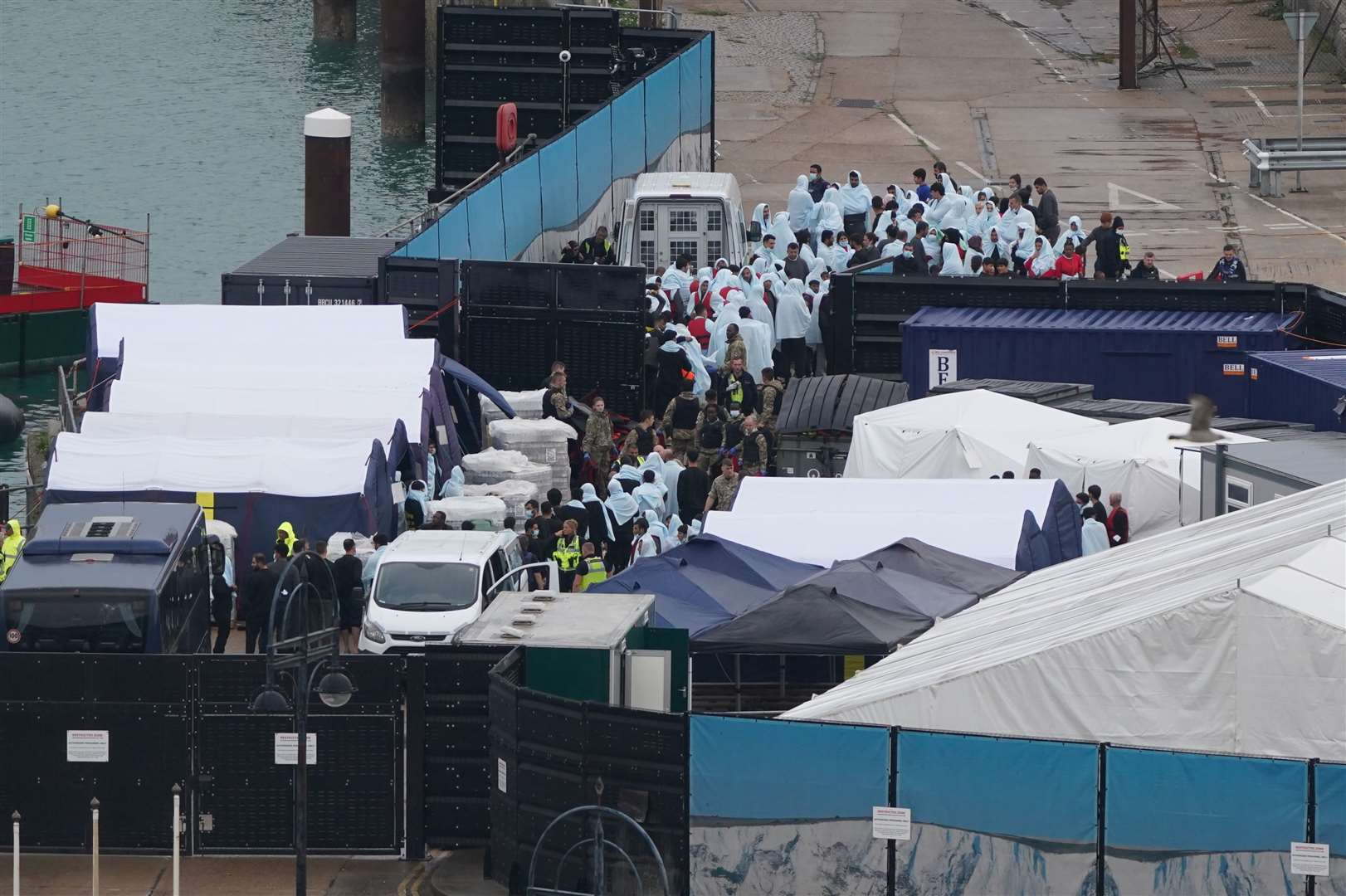 A group of people thought to be migrants at the migrant processing centre in Dover Picture: PA