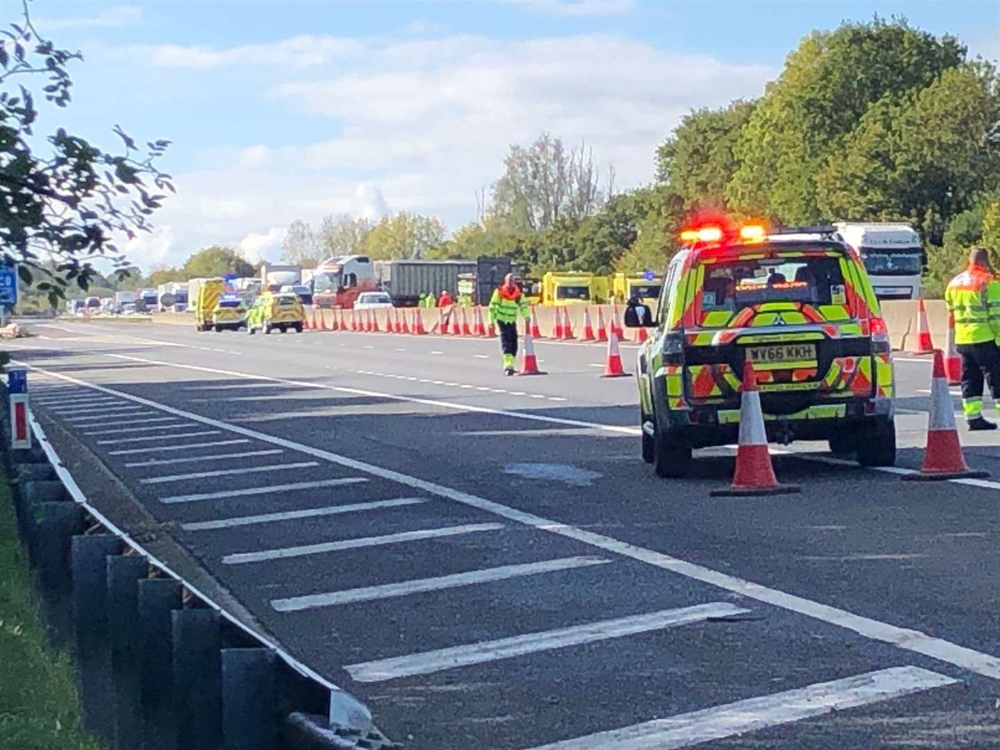Emergency services at the scene on the M26. Picture: Rob Pembroke