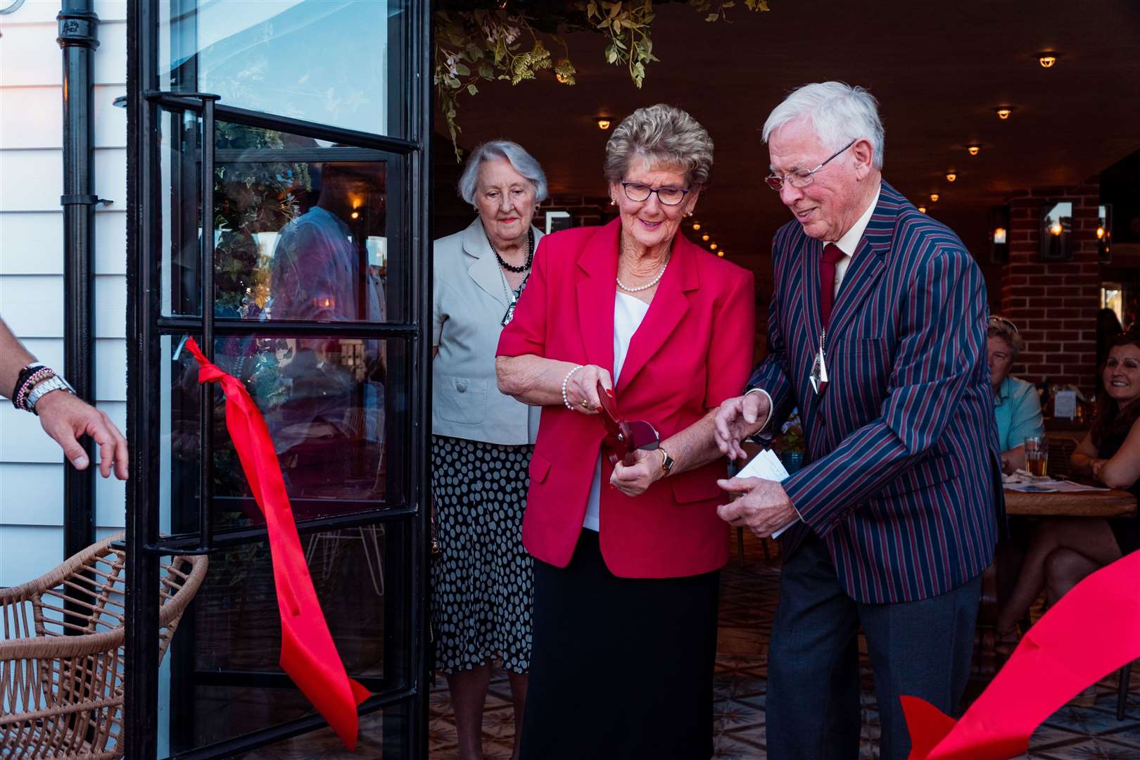 Monique Chaussy, 82, cuts the ribbon with Cllr John Link