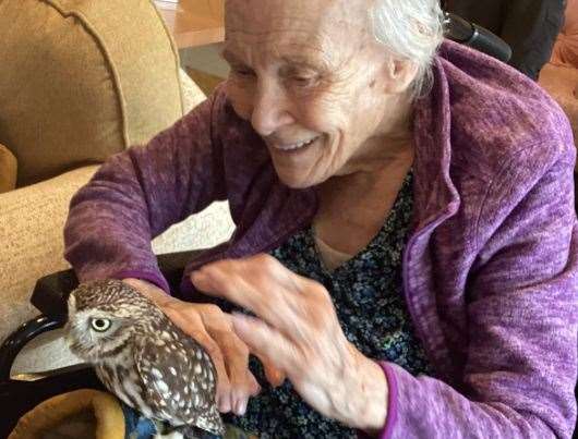 A resident at Birchwood Heights Care Home in Swanley with one of the owls