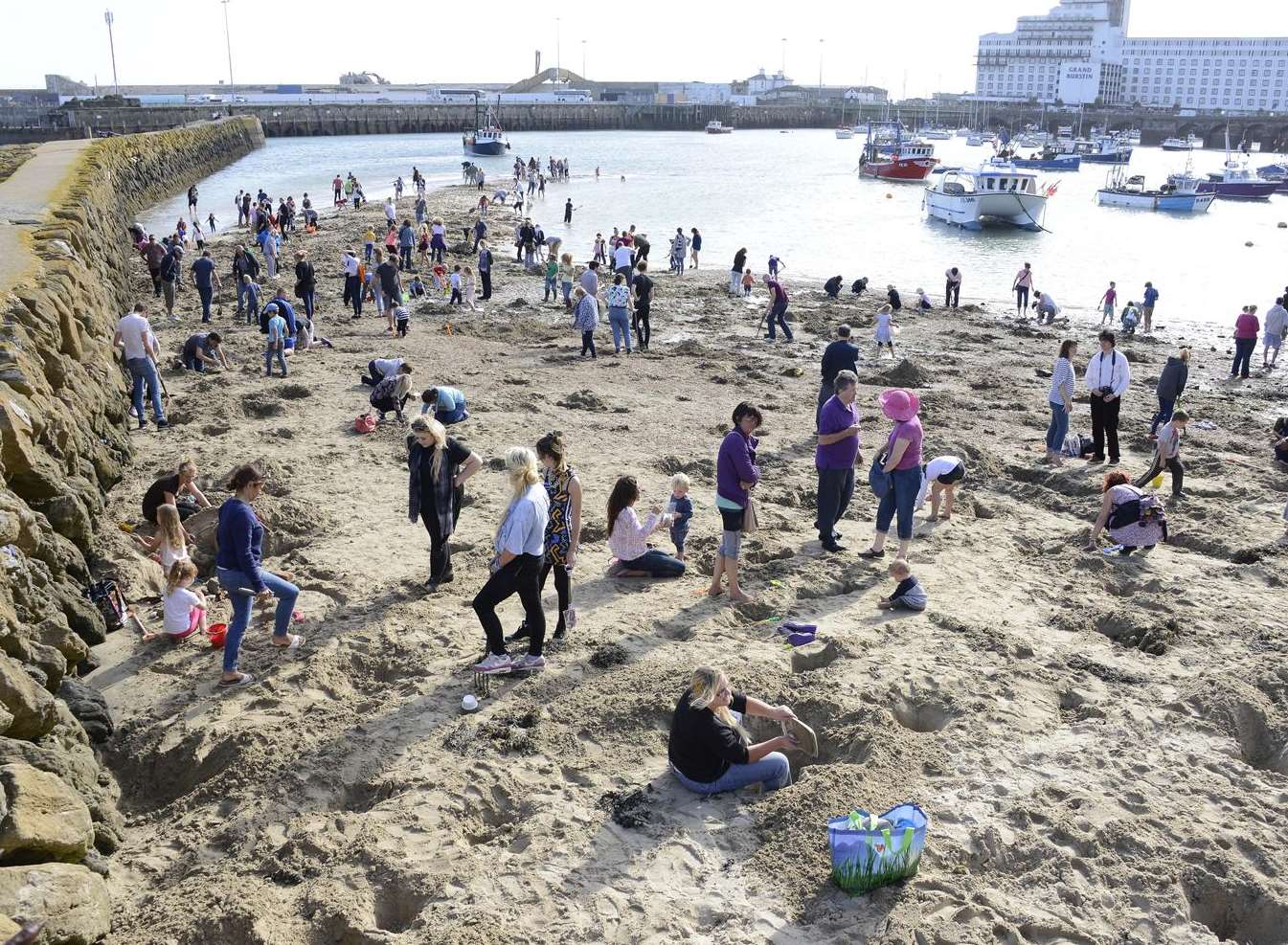 People digging for gold on the beach when the project was announced. Picture: Paul Amos