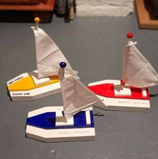 Three model boats taking part in the Freemasons' Great East Kent Boat Race