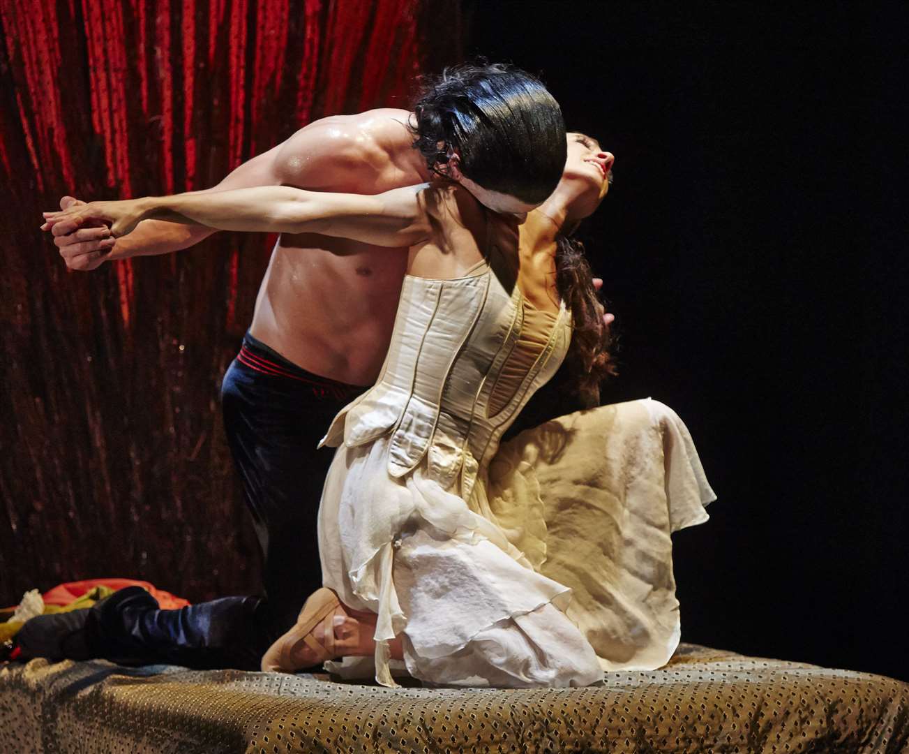 Dracula gets to grips with Mina in the Northern Ballet's version of the blood-thirsty tale. Picture: Justin Slee