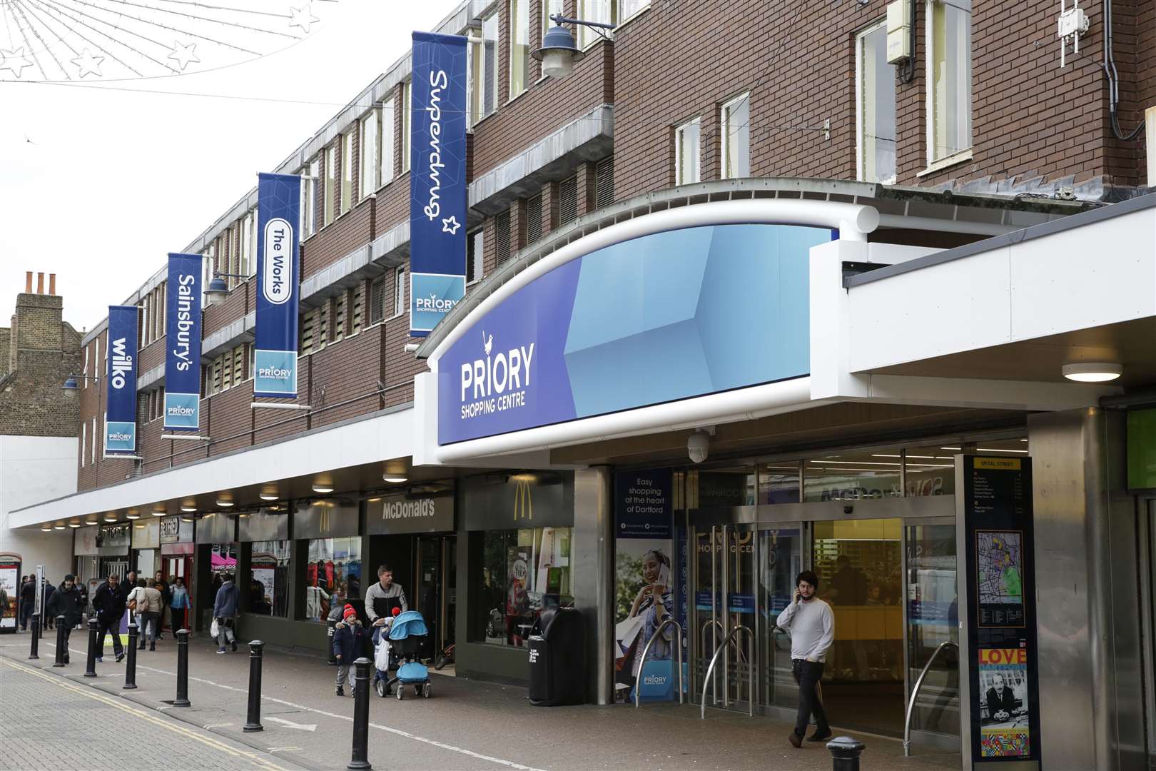 The woman fell ill and was resuscitated at the Priory Shopping Centre in Dartford