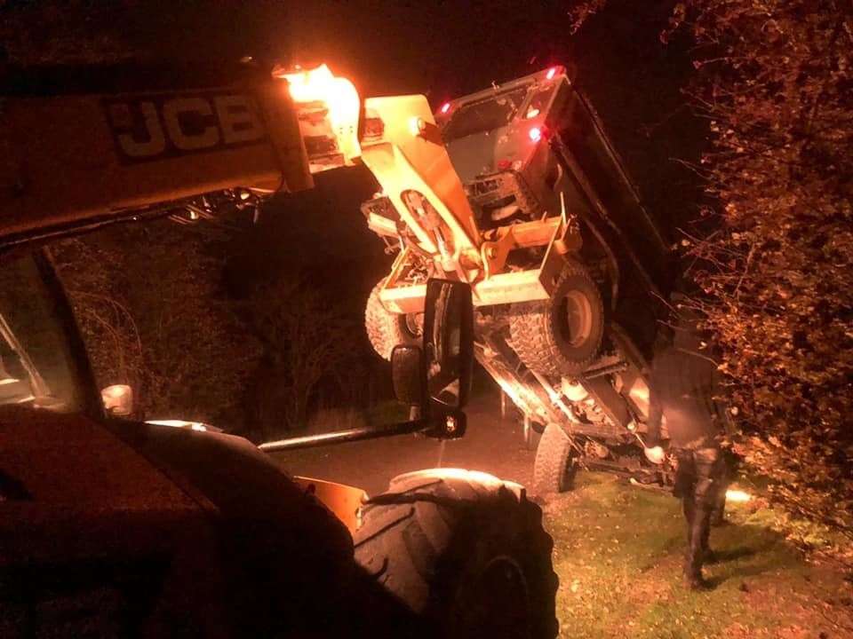 A JCB was used to hoist the Land Rover into the air