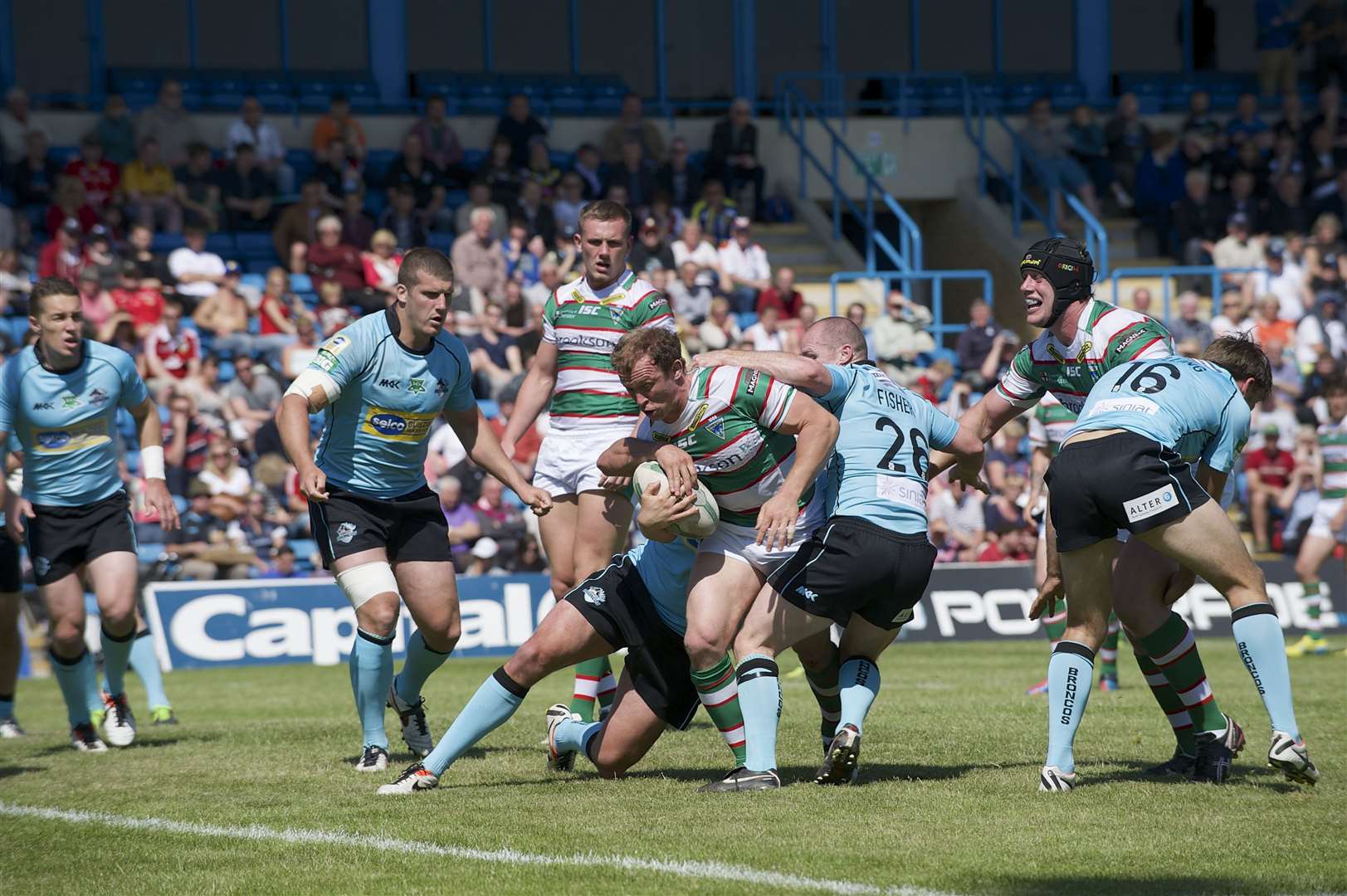 London Broncos (pale blue) found Warrington Wolves too hot to handle at Gillingham's Priestfield stadium in 2013. Picture: Andy Payton