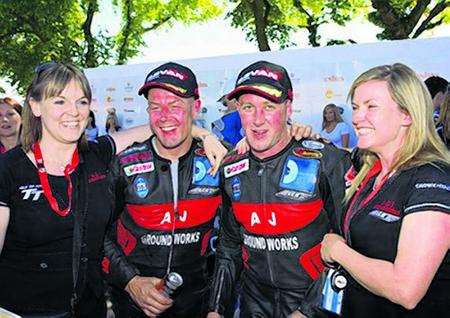 Winners of the Isle of Man TT 2008 Sidecar race. Amanda Reed (Mark Cox's partner), Mark Cox (passenger), Nick Crowe (driver) and Danny Crowe (Nick's wife)