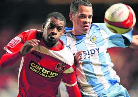 Charlton's Izale McLeod (left) takes on Coventry defender Marcus Hall
