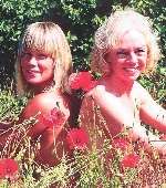 Ian Parrott's widow, Yvonne, right, with daughter Lisa pose in a field of poppies for the calendar