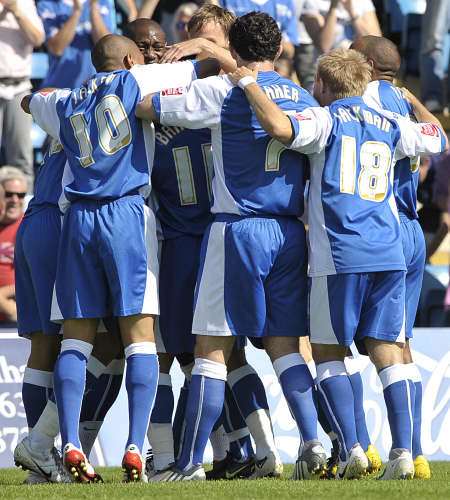 Gills players congratulate Andy Barcham on his goal