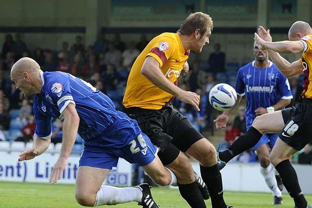 Captain Adam Barrett in the thick of the action against Bradford on Saturday. Picture: Barry Goodwin
