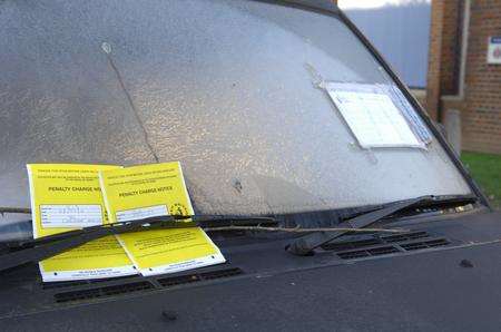The parking tickets on the car left outside Sittingbourne police station despite a police note to say the owner has been taken to hospital