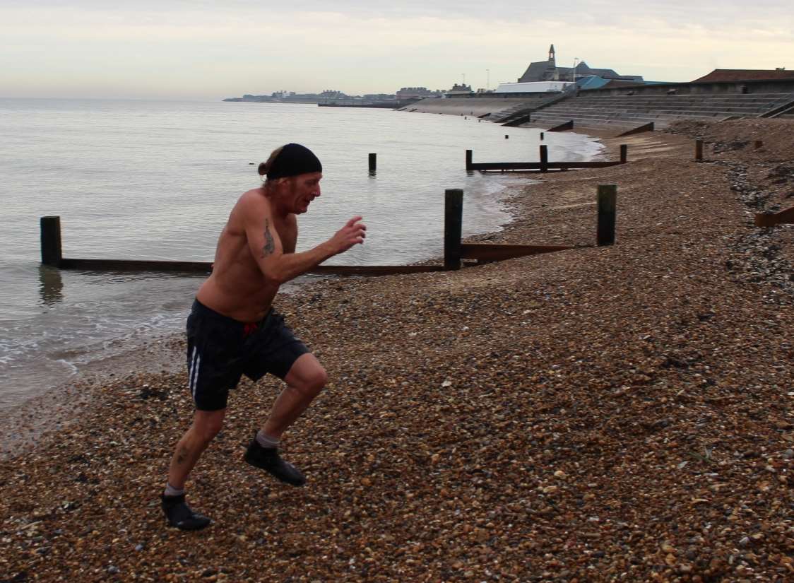 That's it! Ian Arnell makes a dash out of the sea.