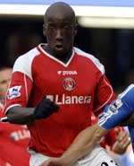 Souleymane Diawara (above) is likely to be out for four weeks, while Djimi Traore (below) has fractured his left leg