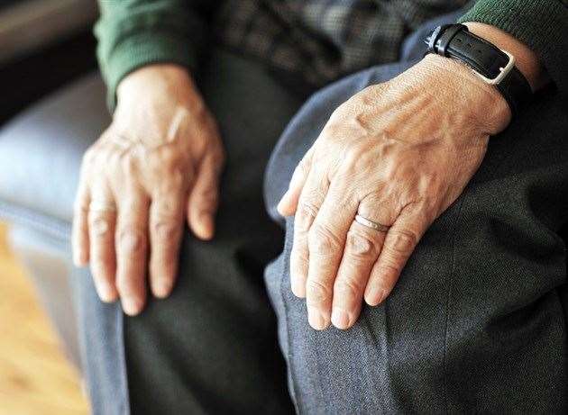 There are more than 40 symptoms of Parkinson's. Stock image